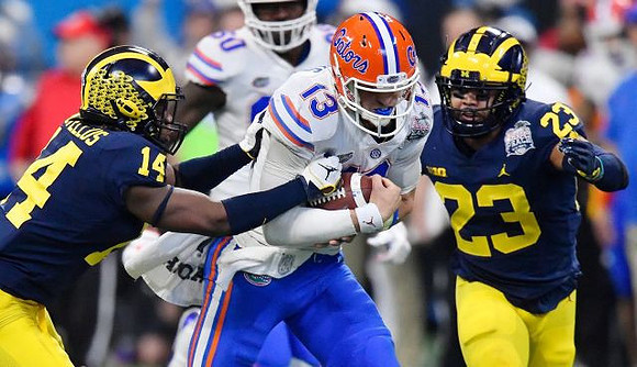 Josh Metellus (14) and Tyree Kinnel (23)