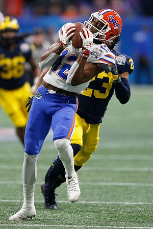Tyree Kinnel (23) and Devin Gil (36)