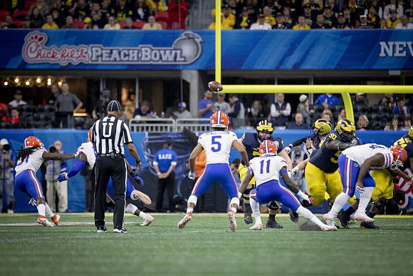 Ben Bredeson (74), Shea Patterson (2), Michael Onwenu (50), and Cesar Ruiz (51)