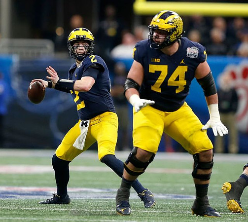 Shea Patterson (2) and Ben Bredeson (74)