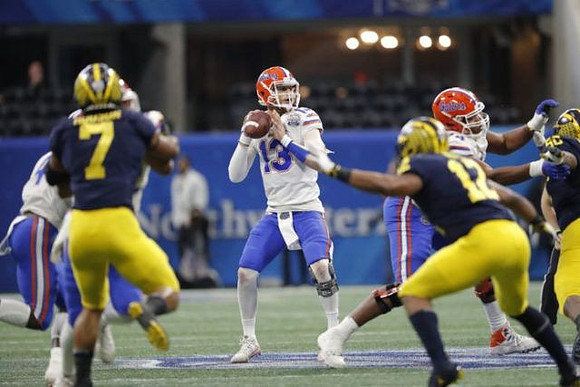 Khaleke Hudson (7), Josh Ross (12), and Michael Dwumfour (50)