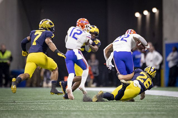 Khaleke Hudson (7), Lavert Hill (24), and J'Marick Woods (26)