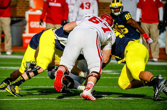 Chris Wormley (43) and Jourdan Lewis (26)