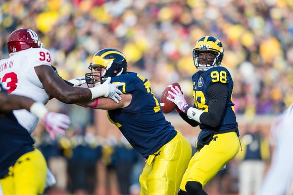 Ben Braden (71) and Devin Gardner (98)