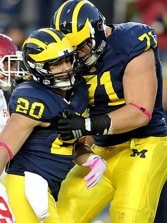 Drake Johnson (20) and Ben Braden (71)