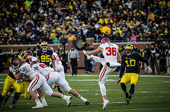 Michael Jocz (95) and Da'Mario Jones (10)