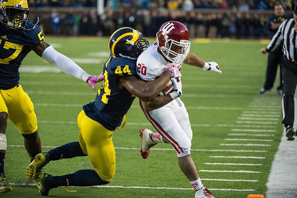 Frank Clark (57) and Delano Hill (44)