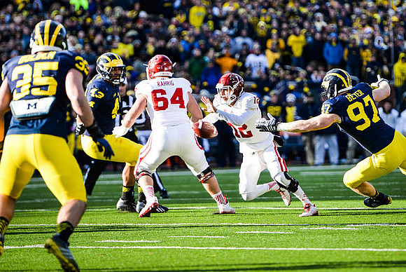 Joe Bolden (35), Chris Wormley (43), and Brennen Beyer (97)