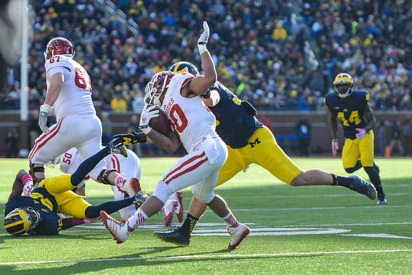Jourdan Lewis (26), Joe Bolden (35), and Delano Hill (44)