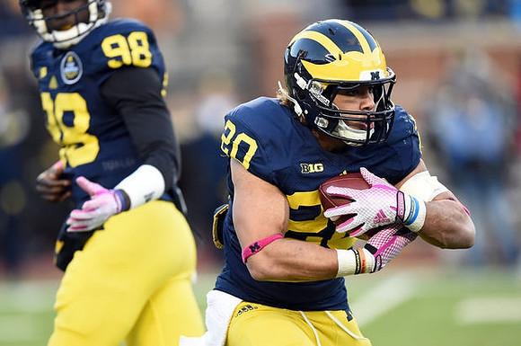 Devin Gardner (98) and Drake Johnson (20)