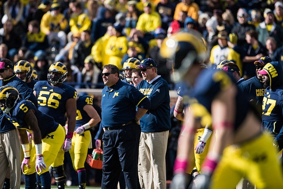 Justice Hayes (5), Ondre Pipkins (56), Matt Wile (45), and Brady Hoke
