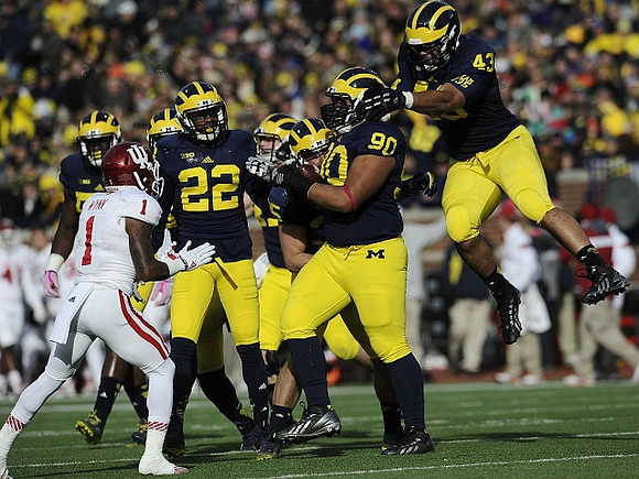 Jarrod Wilson (22), Bryan Mone (90), and Chris Wormley (43)