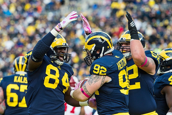 Kyle Kalis (67), A.J. Williams (84), Keith Heitzman (92), Mason Cole (52), and De'Veon Smith (4)