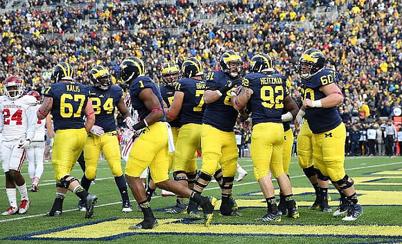 Kyle Kalis (67), A.J. Williams (84), Devin Funchess (1), Ben Braden (71), Erik Magnuson (81), Keith Heitzman (92), and Jack Miller (60)