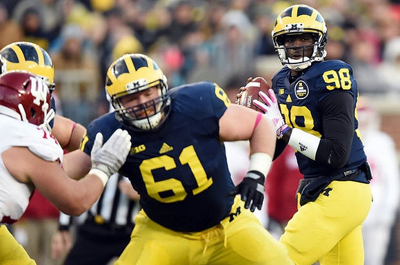 Graham Glasgow (61) and Devin Gardner (98)