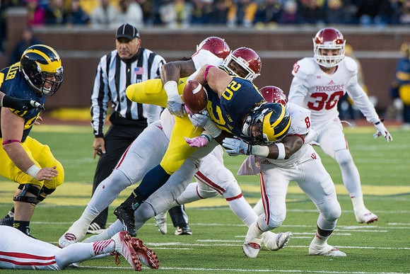 Jack Miller (60) and Drake Johnson (20)