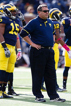 James Ross (15), Brady Hoke, and Allen Gant (12)
