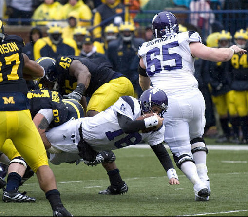 Brandon Harrison (27), Will Johnson (97), and Obi Ezeh (45)