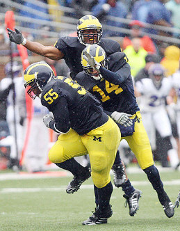 Brandon Graham (55) and Morgan Trent (14)