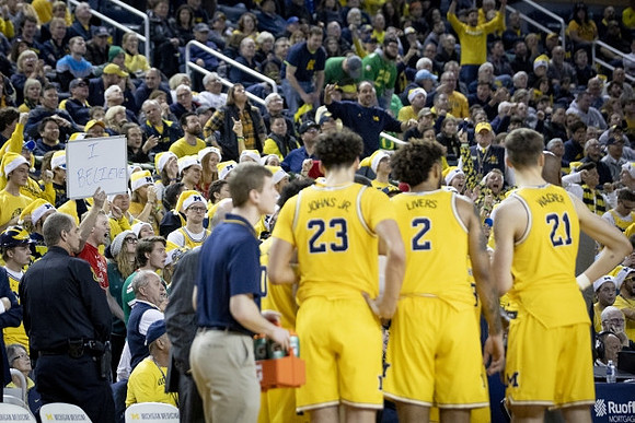 Brandon Johns Jr. (23), Isaiah Livers (2), and Franz Wagner (21)