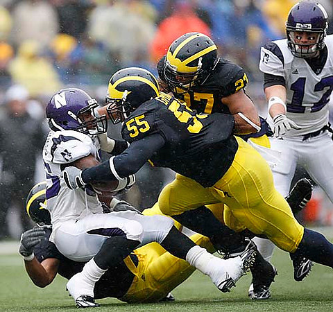 Brandon Graham (55) and Brandon Harrison (27)