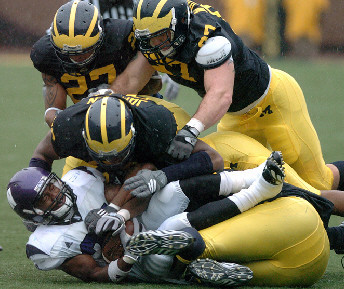 Tim Jamison (90), Brandon Harrison (27), and Will Johnson (97)