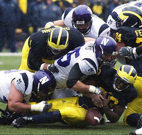 Mark Ortmann (71), John Ferrara (74), and Carlos Brown (23)