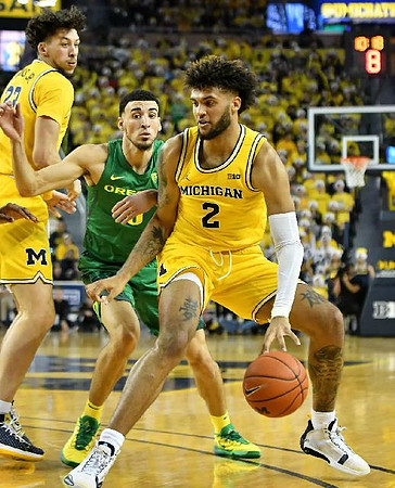 Brandon Johns Jr. (23) and Isaiah Livers (2)