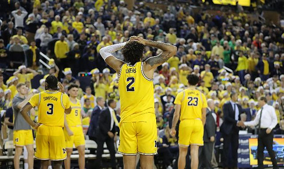 Zavier Simpson (3), Adrien Nunez (5), Isaiah Livers (2), and Brandon Johns Jr. (23)
