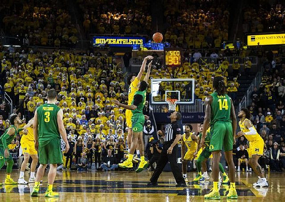 Brandon Johns Jr. (23), David DeJulius (0), and Isaiah Livers (2)