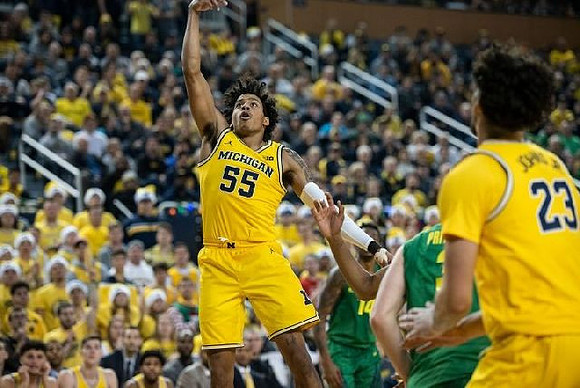 Eli Brooks (55) and Brandon Johns Jr. (23)