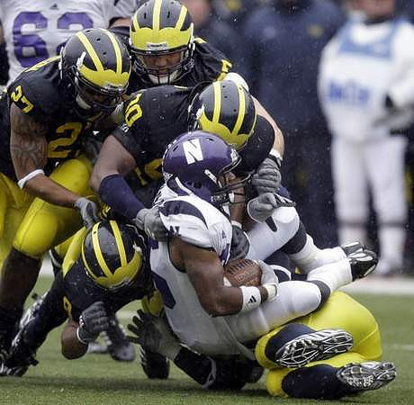 Brandon Harrison (27), Will Johnson (97), Jonas Mouton (8), and Tim Jamison (90)