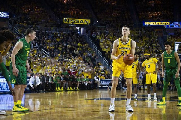 Isaiah Livers (2), Franz Wagner (21), David DeJulius (0), and Zavier Simpson (3)
