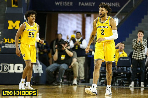 Eli Brooks (55) and Isaiah Livers (2)