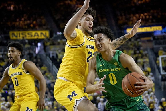 David DeJulius (0) and Isaiah Livers (2)