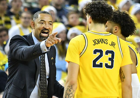 Juwan Howard, Brandon Johns Jr. (23), and Isaiah Livers (2)