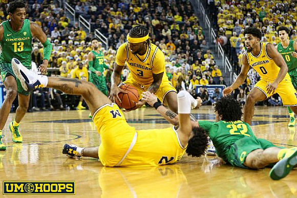 Isaiah Livers (2), Zavier Simpson (3), and David DeJulius (0)