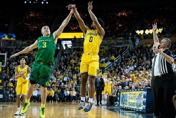 Eli Brooks (55) and David DeJulius (0)