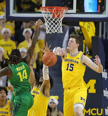 Eli Brooks (55), Isaiah Livers (2), and Jon Teske (15)