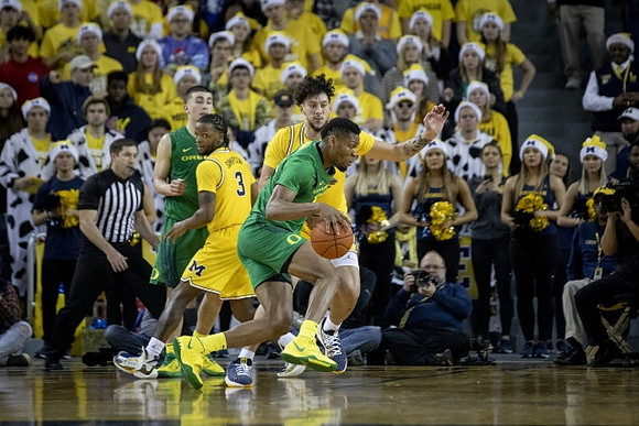 Zavier Simpson (3) and Brandon Johns Jr. (23)