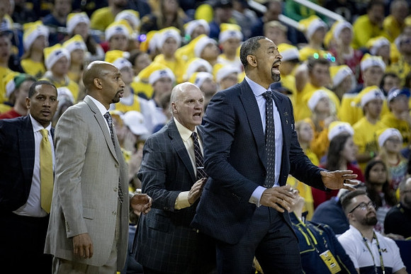 Howard Eisley, Saddi Washington, Phil Martelli, and Juwan Howard