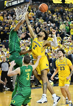 Isaiah Livers (2) and Brandon Johns Jr. (23)