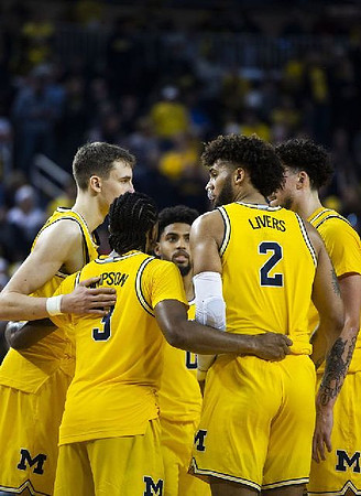 Franz Wagner (21), Zavier Simpson (3), David DeJulius (0), Isaiah Livers (2), and Brandon Johns Jr. (23)