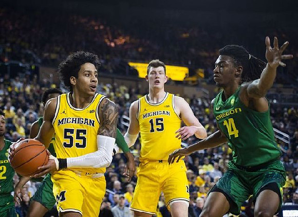 Eli Brooks (55) and Jon Teske (15)