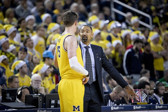 Jon Teske (15) and Juwan Howard
