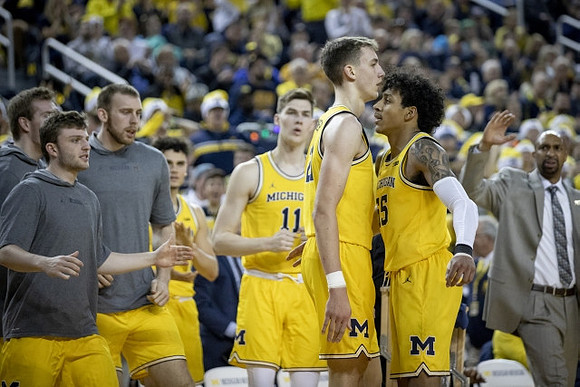 Colin Castleton (11), Franz Wagner (21), and Eli Brooks (55)