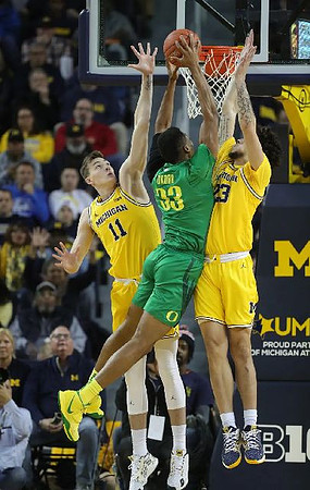 Colin Castleton (11) and Brandon Johns Jr. (23)