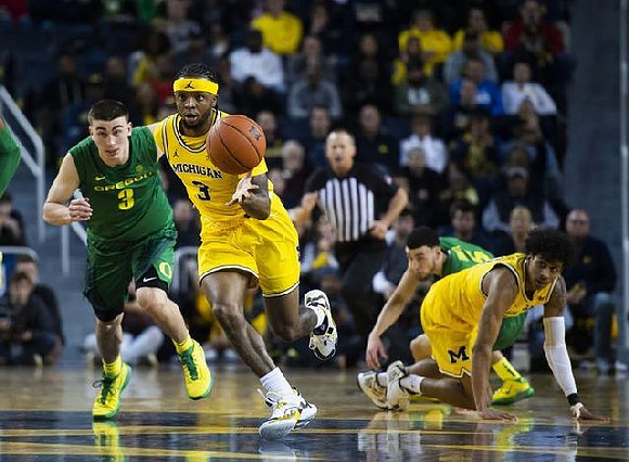 Zavier Simpson (3) and Eli Brooks (55)