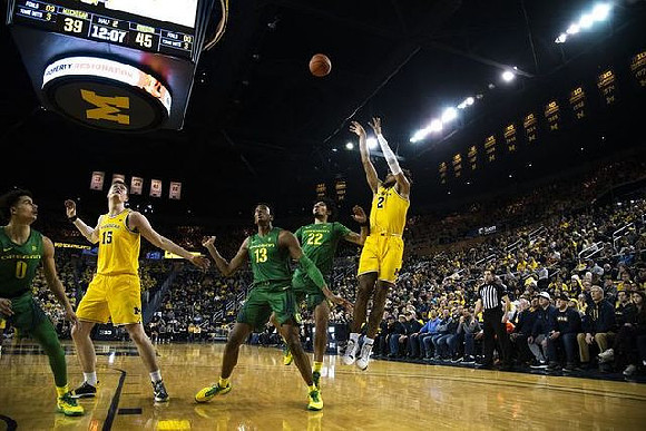 Jon Teske (15) and Isaiah Livers (2)