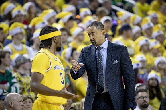 Zavier Simpson (3) and Juwan Howard